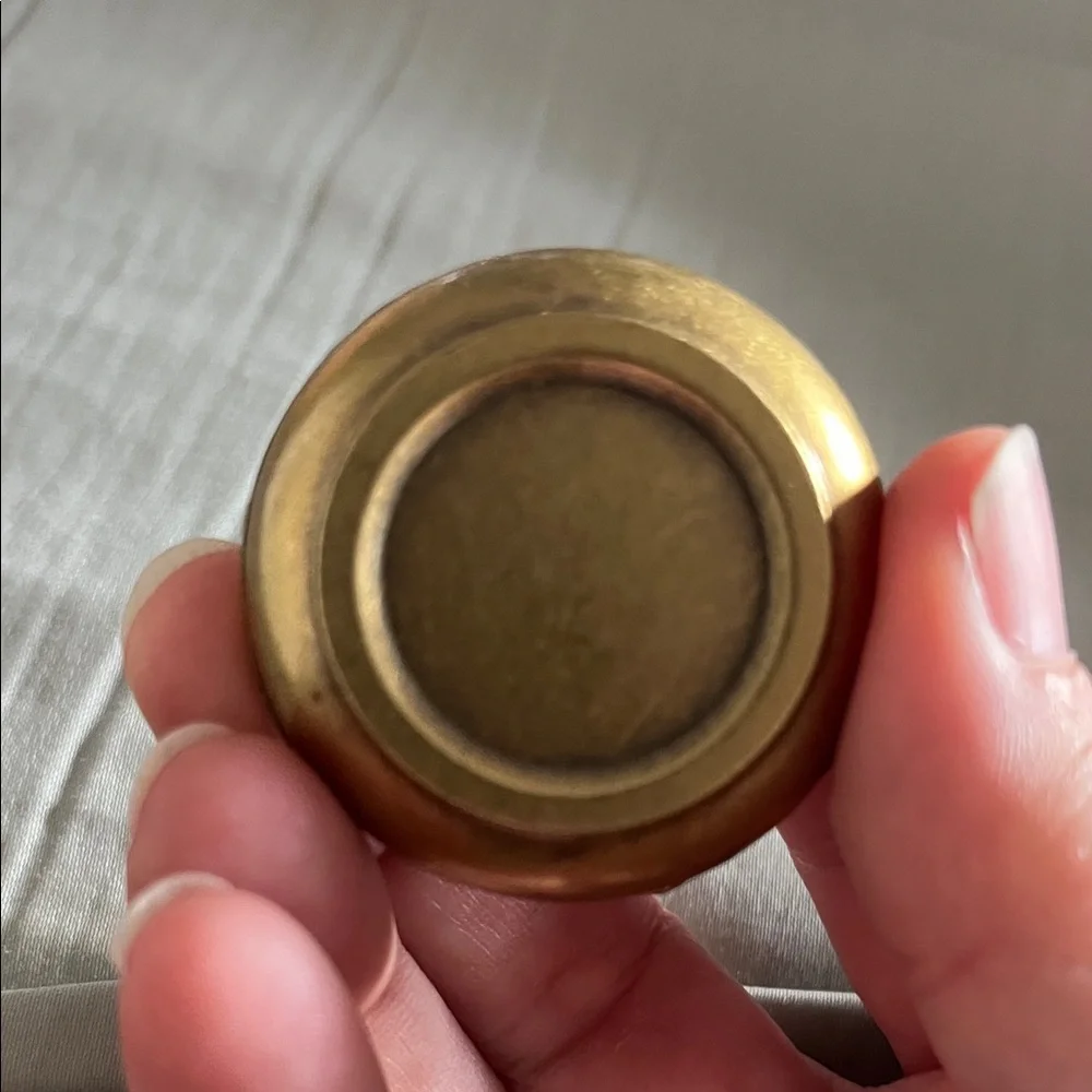 Brass spiderweb incense holder.